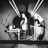 Scientist Dr. Sig Hansen, Clad in 50lb Aluminum and Steel Space Suit in Vacuum Chamber, 