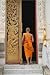 A Buddhist Monk Walks through the Door of a Temple in Laos - 24