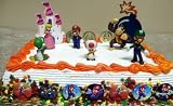 Mario Brothers 23 Piece Birthday Cake Topper Set Featuring Mario Castle, Bomb, Mario Coins, 6 Mario Figures Including Mario, Luigi, Princess Peach, Toad, Yoshi, Donkey Kong, and 12 Mario 1 Decorative Buttons