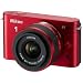 Nikon 1 J1 Systemkamera (10 Megapixel, 7,5 cm (3 Zoll) Display) rot inkl 1 NIKKOR VR 10-30 mm Objektiv
