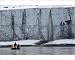 Photographic Prints of Tourists in a zodiac watch a waterfall tumble from from ArcticPhoto