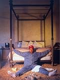Entertainment Mogul Russell Simmons Relaxing on Bedroom Floor at Foot of Four-Poster Bed Premium Photographic Poster Print by Ted Thai, 24x32