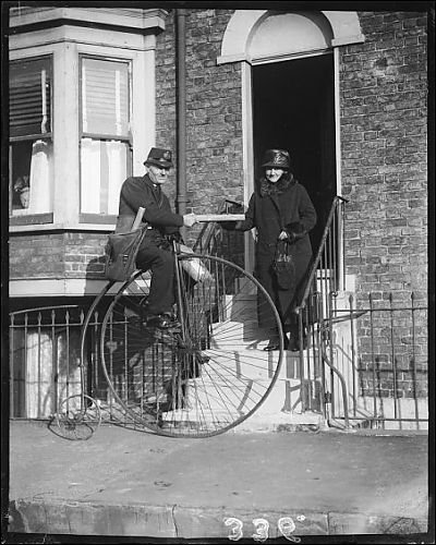 Photographic Prints of Postman On Pennyfarthing from Mary Evans