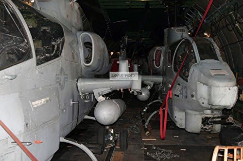 Photo Two US Marine Corps (USMC) AH-1W Super Cobra Helicopters, 2nd Marine Aircraft Wing (MAW), Marine Corps Air Station (MCAS) Cherry Point, North Carolina (NC), are parked inside a Russian Volga-Dnepr Service Antonov AN-124-100 cargo aircraft waiting to be offloaded at MCAS Cherry Point, 07/26/2004
