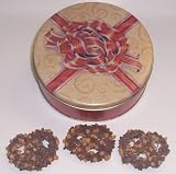 Scott's Cakes 1 lb. Milk Chocolate Covered Pretzel with Chocolate Chips & Peanut Butter Chips in a Red Bow Tin