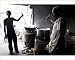 Photographic Print of Young man and blind man stirring milk for chai, roadside chai stall, from Robert Harding