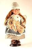 Charming Childrens collector doll - porcelain head and limbs - comes with small teddy or dog toy (assorted) - and display stand