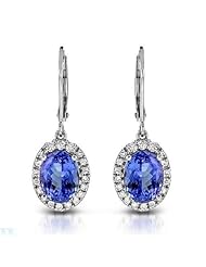 Celine F 14K White Gold 4.72 CTW Tanzanite and 0.48 CTW Color G-H I1 Diamond Ladies Earrings. Length 29 mm. Total Item weight 4.1 g.