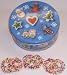 Scott's Cakes 1 lb. Milk Chocolate Covered Pretzel with Rainbow Jimmies in a Christmas Cookie Tin