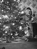 Mrs. George Sutton and Her Family Decorating Their Christmas Tree at Home Photographic Poster Print