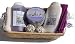 SPA Lavendel Wellness Geschenkset 8 tlg. Duschgel, Bodylotion, 2 x Badepraline, Duftkerze, 2 x Handtuch 30/50 lila und creme - weiß im Bambuskorb