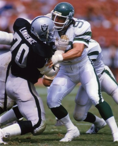 HENRY LAWRENCE OAKLAND RAIDERS & MARK GASTINEAU NEW YORK JETS 8X10 SPORTS ACTION PHOTO