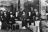Immigrant Men Sitting at Ellis Island Art Print Poster By unknown, 27.5  x 18.75 