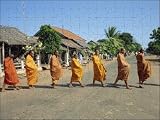 Photo Jigsaw 17x12 (43x30cm) Monks with begging bowls beneath saffron robes go out from Robert Harding