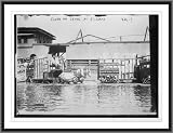 Newswire Photo S Horse-drawn shoe wagons flooded levee St. Louis