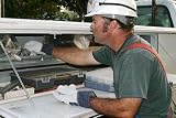 Electrician Reaches in Service Truck - 18W x 12H - Peel and Stick Wall Decal by Wallmonkeys