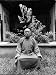 Village Elder Wei Sse Chi Sitting in Courtyard Behind Teashop Photographic Poster Pri...