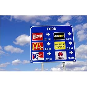 photographie Road sign advertising fast food outlets on Interstate 70. est disperible en (L x H):...