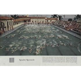 The Face of America: Splashy Spectacle. One hundred swimmers, churning through the pool, are taking part in an event called the "salmon run." This exhibition of youthful energy serves as a warm-up for the East-West swimming meet held yearly by the College Coaches Swim Forum at Fort Lauderdale, Florida. Here, during the winter holidays, more than six hundred college and high-school athletes and coaches convene for a seminar in aquatics on the eve of the competitive season. Once, as an opener for the East-West meet, the forum sponsors tried pitting the exuberant college stars against a pair of seals. But, as the story goes, the seals blithely swam two lengths to the boys' one, then couldn't be coaxed out of the pool. So now, as a prelude to the months of racing against one another in earnest, the collegians plunge into the water for this frolic. Photograph by Bill Shrout. ..... 1959 Saturday Evening Post Picture, A5235A. post19590228