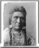 Wolf,Crow Indian Man,earrings,necklaces,Montana,MT,Edward S Curtis,photographer