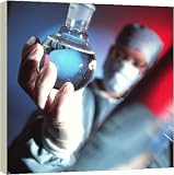 Review Media Storehouse  / Chemist holding a round bottomed flask - 16 Inch Canvas Print (40 cm) by Science Photo Library
