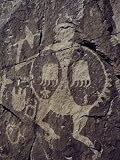 15th-Century Petroglyph Showing a Warrior with a Bear-Claw Shield Premium Photographic Poster Print by Ira Block, 12x16