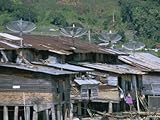 IMAGE OF Stilt Houses with Satellite Dishes, Haranggaol, North Shore of Lake Toba, Sumatra, Indonesia Premium Photographic Poster Print by Robert Francis, 30x40