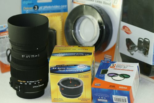 Sigma 50-200mm F4-5.6 DC OS HSM Lens Kit + 2X Auto Focus Tele Converter 100-400mm With Case , Hood , Set of 3 Filters , Extended Warranty , Cap Keeper , Cleaning kit For All Canon EOS Digital SLR Cameras.