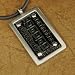 J1084 Designer Inspired Ancient Symbols Cross Pendant Italian Style Stainless Steel Uni-sex Black Pendant on a Rubber Cord Gift Boxed