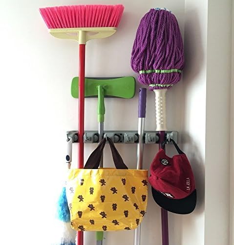 The Strongest Grippers Mop Broom Holder Found Only on Amazon. Items Stay Put Guaranteed Non Slide. Lifetime Guarantee. by Champ Grip