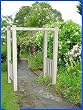 The Bloomfield Adjustable Width Tan Vinyl Arbor