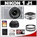 Nikon 1 J1 10.1 MP Digital Camera Body with 10mm f/2.8 & 10-30mm VR Lens (Silver) with 32GB Card + Case + (2) UV Filters + Accessory Kit