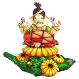 Colorful Dholak Ganesh Statue on a Bed of Flowers
