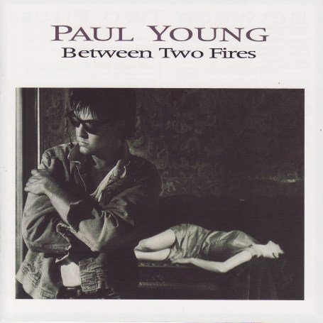 Paul Young - Between Two Fires - Zortam Music