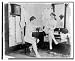 Historic Print (L): [Two young women, wearing long underclothing, one seated on chair...