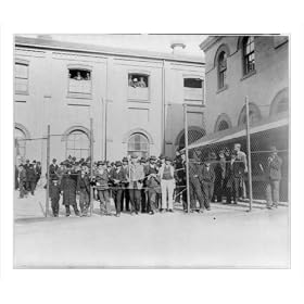 Historic Print (M): [Immigrants from a smallpox ship, held in custody for observation, behind wire fence, Ho