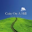 Coin On A Hill