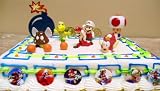 Exclusive, Unique Mario Brothers 20 Piece Birthday Cake Topper Featuring 6 Super Mario Characters Including Goomba, Koopa Troopa, Mario Mushroom, Cheep Cheep Flying Fish, And 2 Mario Spit Fires, 3 Mario Coins, Large Bomb, 6 Mario 1
