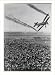 Historic Print (L): [Siemens-Stieglitz D-Ekro biplane releasing smoke streams from wi...