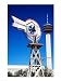 USA, Texas, San Antonio, Tower of the Americas and old windmill Poster (18.00 x 24.00)