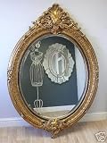 Huge oval gilt ornate wall mirror