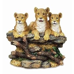 A Safari Fugurine with Three Female Lioness' Sitting On A Bed Rock