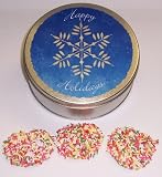 Scott's Cakes White Chocolate Covered Pretzel with Rainbow Jimmies in a Mini Snowflake Tin