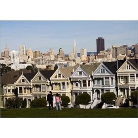 photographie People relaxing in Alamo Square with Victorian houses and downtown in background. es...