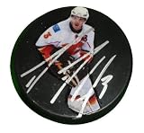Dion Phaneuf Autographed Calgary Flames Photo Hockey Puck, Proof Photo of Dion Signing for Us.