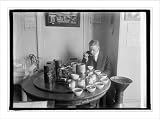 Historic Print (M): George F. Mitchell of Bu. of Chemistry of Ag. Dept. testing tea, 1/23/25