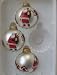 Package containing 3 glass ball Ornaments with Santa Claus on one side. The other sid...