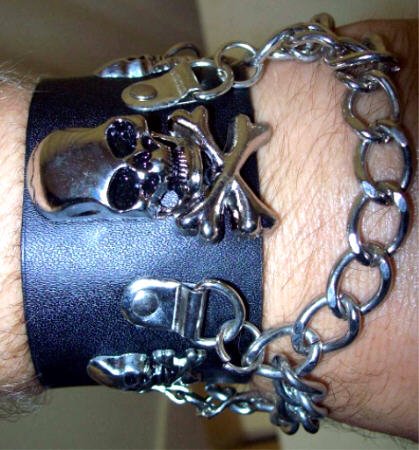 Click here to buy Black Leather Skulls and Chains Bracelet Wristband by Coolstuff4U.