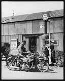 Photographic Prints of Motor Bike At Pump from Mary Evans