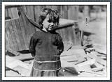 Historic Print (S): [Girl standing, arms behind her back, apparently in front of pile of planks]. Location: